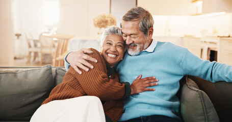 Senior, couple and relax in living room with hug, smile and bonding together for retirement...