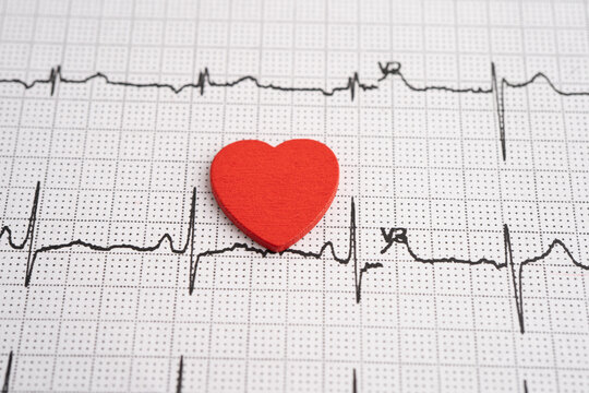 Red heart on electrocardiogram ECG with red heart, heart wave, heart attack, cardiogram report.