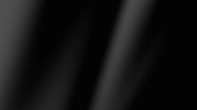 Abstract black background with subtle gradient and fine grain texture