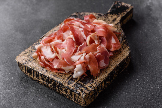Slices of pork pancetta, ham, or bacon for a festive antipasto platter