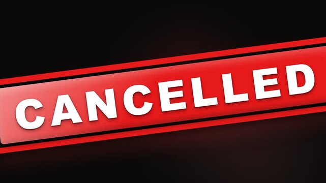 A bold red sign displaying the word cancelled in bold, white, capital letters, conveying a sense of termination or cessation for an event or plan