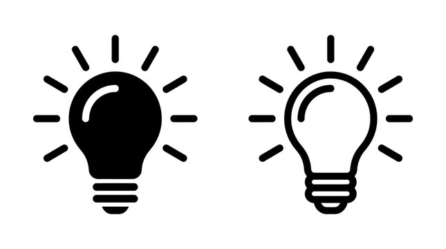 Light bulb icon set with glowing rays in solid and outline vector style