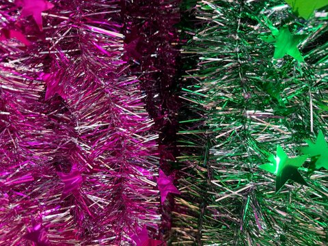 Christmas Purple and green tinsel texture abstract background

