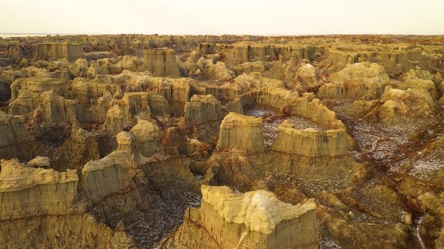 Aerial view of the colorful salt formations and mineral deposits of the Dalol geothermal area in the Danakil Depression, Dalol, Afar, Ethiopia.