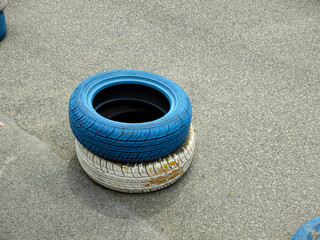 car tires on grey background © Saravut