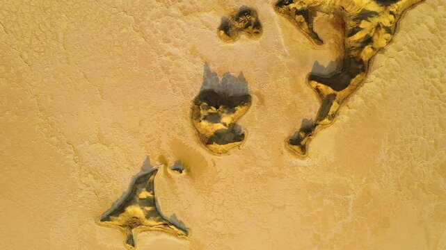 Aerial view of the colorful mineral deposits and salt crusts of the Geothermal Area in Dalol, Afar, Ethiopia.