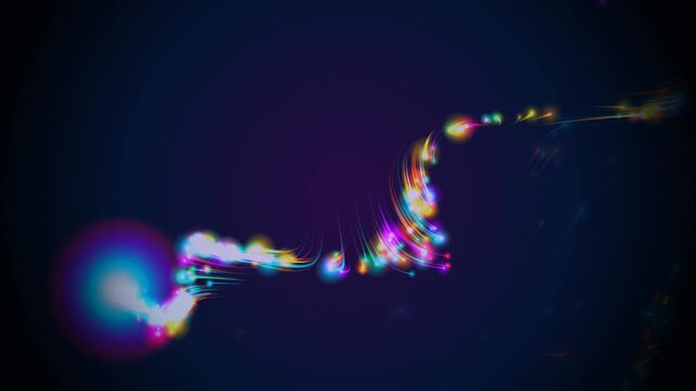 Magical Christmas glowing light trail and particle wake swirling with a bright lens flare. Glowing multicolored particle wake and light trail animation with a bright core