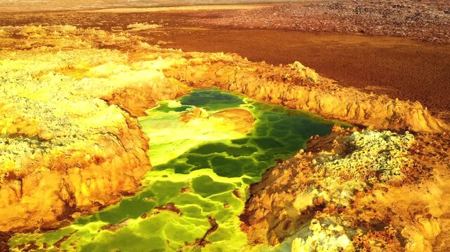 Aerial view of the vibrant yellow and green geothermal pools in the Danakil Depression, Dalol, Afar, Ethiopia.