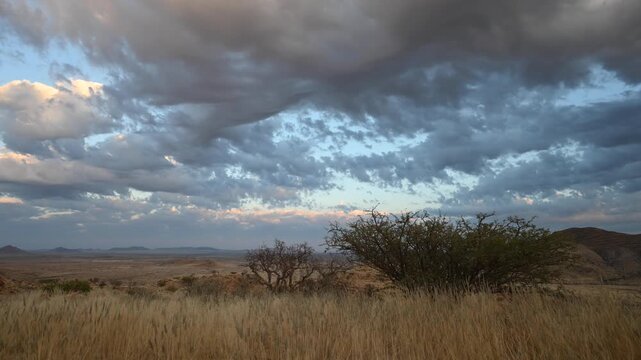 Clouds drift over the Namibian desert, African landscape. Timelapse.