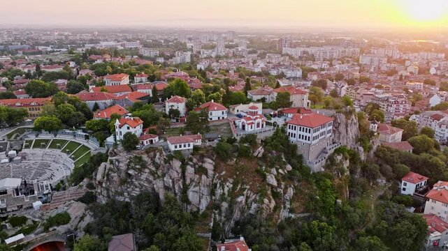 Aerial view Plovdiv old town ancient Roman theatre hill sunrise golden hour summer cityscape travel destination Bulgaria Europe historic landmark panorama