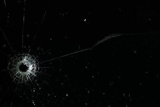 Bullet holes on black glass, overlay design background