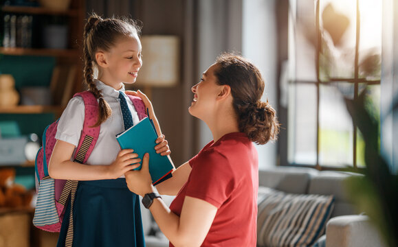 Happy Mother Sending Daughter to School in Morning Routine