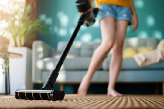 woman vacuuming floor