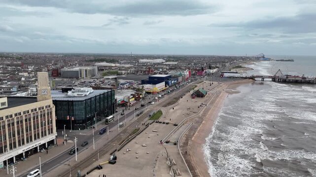 Aerial view of Blackpool promenade and coastline with North Pier in England.