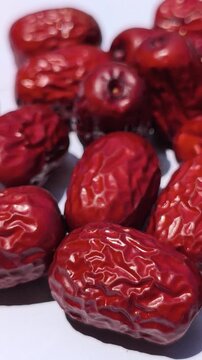 Fresh Chinese jujube (Ziziphus jujuba) fruits with smooth green to reddish-brown skin, commonly consumed fresh or dried and valued as a traditional fruit crop