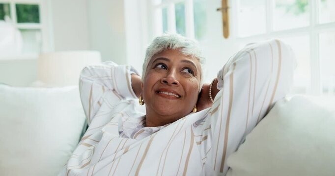 Thinking, woman and stretching at house with smile, peace and reflection for weekend unwind. Happy, mature person or daydreaming in home with vision, remember memory and comfortable for stress relief