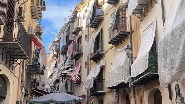 Charming Narrow Street in Palermo Sicily with Historic Buildings and Balconies