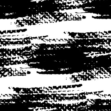Seamless pattern from abstract textured black strokes on white paper
