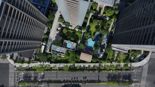 Aerial view of modern residential complex with garden and swimming pool