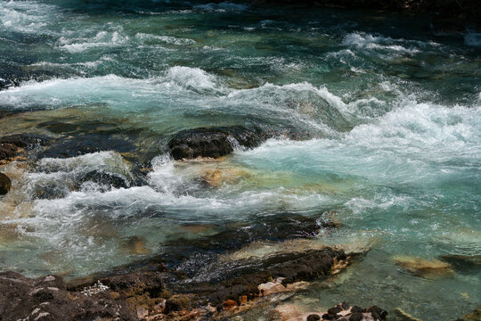 Zabljak, Zabljak Municipality, Montenegro - 29 July 2005: View of the turquoise waters of the Tara River flowing over rocks in the Tara River Canyon.