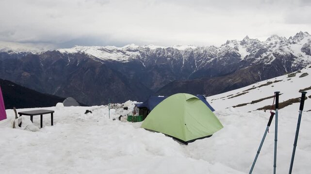 High Altitude Mountain Camp With Tents on a Snow Covered Slope