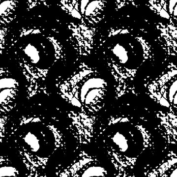 Seamless pattern from abstract textured black circle strokes on white paper