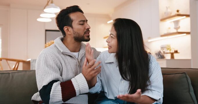Couple, argument or sorry with conflict on sofa for home disagreement, sincerity or remorse. Woman, man and apology with compassion for separation, mistake or emotional comfort together in house