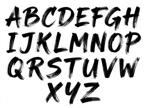 Black handwritten alphabet letters drawn with rough dry brush strokes on paper