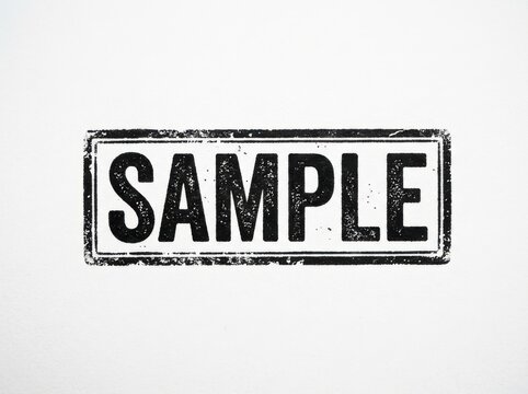 Black ink rubber stamp with the word sample inside a rectangular border frame