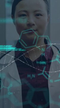 Chemical and DNA structure moving against female doctor standing in hospital