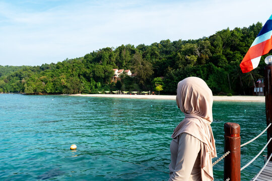 Side view of a beautiful young woman at Manukan island Sabah Borneo Malaysia