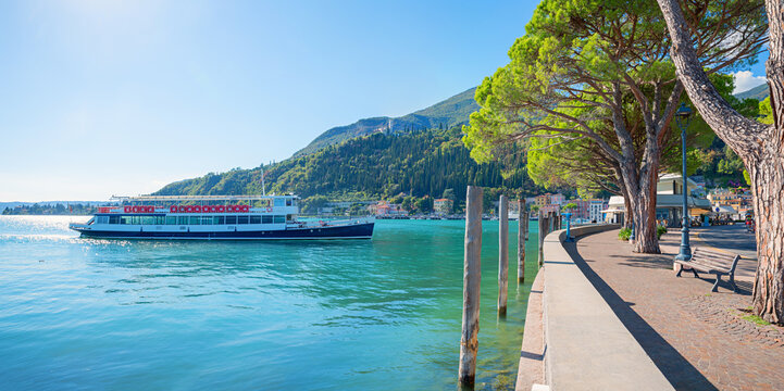 Passenger ship heading towards the port of Maderno, cruise on Lake Garda. destination italy