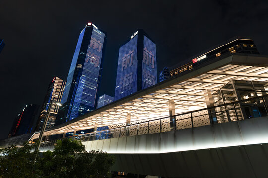 Pedestrian bridge and illuminated buildings in Qianhai Shenzhen