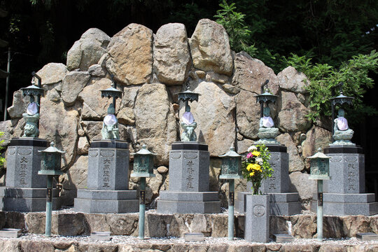 Bronze Buddhist Statues and Boulder Wall at Yakuri-ji Temple on Shikoku Henro Pilgrimage, Kagawa, Japan 2026