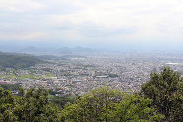 Obraz premium Elevated City Panorama from Yakuri-ji Temple on Shikoku Henro Pilgrimage Route, Kagawa, Japan 2026