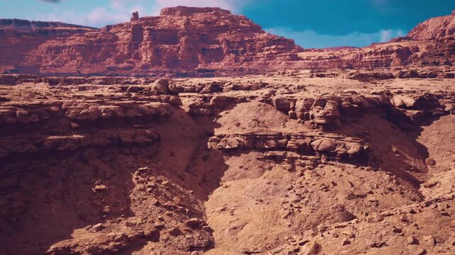 layered sandstone canyon exposing sedimentary strata and erosion patterns, warm sunlight accentuating bands and rock texture, visible outcrops and fault lines