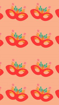 Animation of carnival mask repeated on orange backgroud