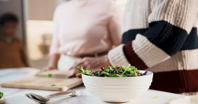 Family, hands or meal prep with vegetables in kitchen for salad bowl, hospitality or cooking food. Parents, person or tossing garnish with cutting board for healthy diet, cuisine or dinner in house