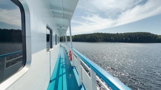 A cruise ship sails along the sparkling waters of Valaam, Lake Ladoga. This peaceful journey inspires calm, happy feelings of joyful adventure and relaxation.