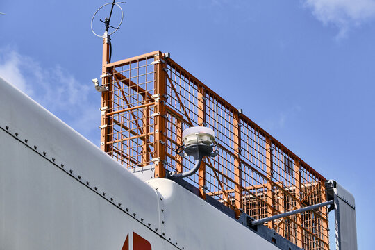 Thisted, Denmark - 11 August 2026: View of the Wind Test Centre Osterild featuring the nacelle and safety railing of a Vestas V-164 wind turbine against a clear blue sky.
