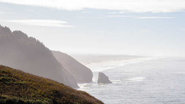 Hazy Costal Landscape with Sea Stack and Cliffs