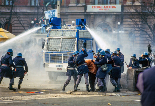 Belgrade, Serbia - 09 March 1991: View of police using a water cannon against protesters at Republic Square during the 1991 demonstrations.