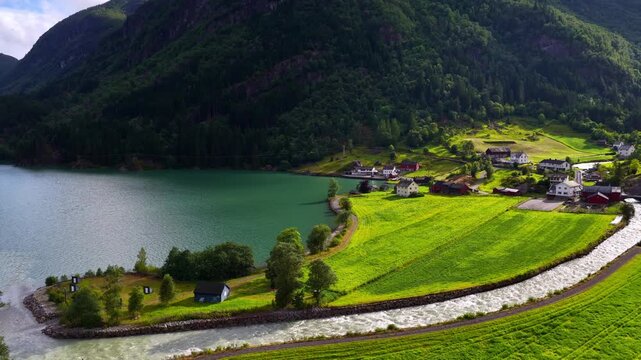 Norwegian nature near Odda village, pristine glacier lake and waterfall on Sorfjorden fjord in western Norway, hiking and travel in Scandinavia, Scandinavian holiday
