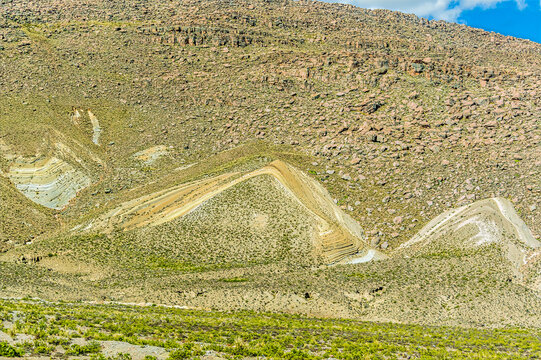 A view of a geological site showing intensely deformed, colorful Cambrian aged sedimentary layers in the Andes Mountains  in southern Peru in the dry season
