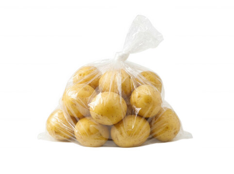 Raw baby potatoes in clear plastic bag isolated on transparent