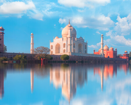 Taj Mahal mausoleum reflected in Yamuna river at sunny day - Agra, Uttar Pradesh, India