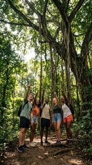 Naklejka premium diverse group of young friends hiking in lush tropical rainforest. caucasian and african american tourists pointing up at tall jungle trees. adventure travel, nature exploration, ecotourism.