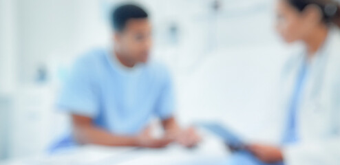 Fototapeta premium A healthcare professional discusses treatment with a patient in a hospital setting, emphasizing the importance of communication in medical care.