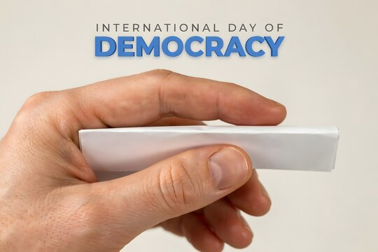 Hand holding a blank paper for International Day of Democracy concept