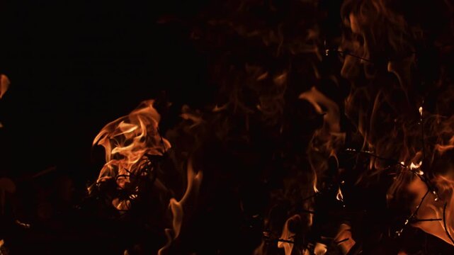 Fire flames dancing slowly. Fire burning natural combustion. Fire glowing warm light. Fire wallpaper style background.